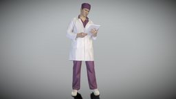 Male doctor reading patient history 277