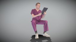 Surgeon is sitting and reading documents 156